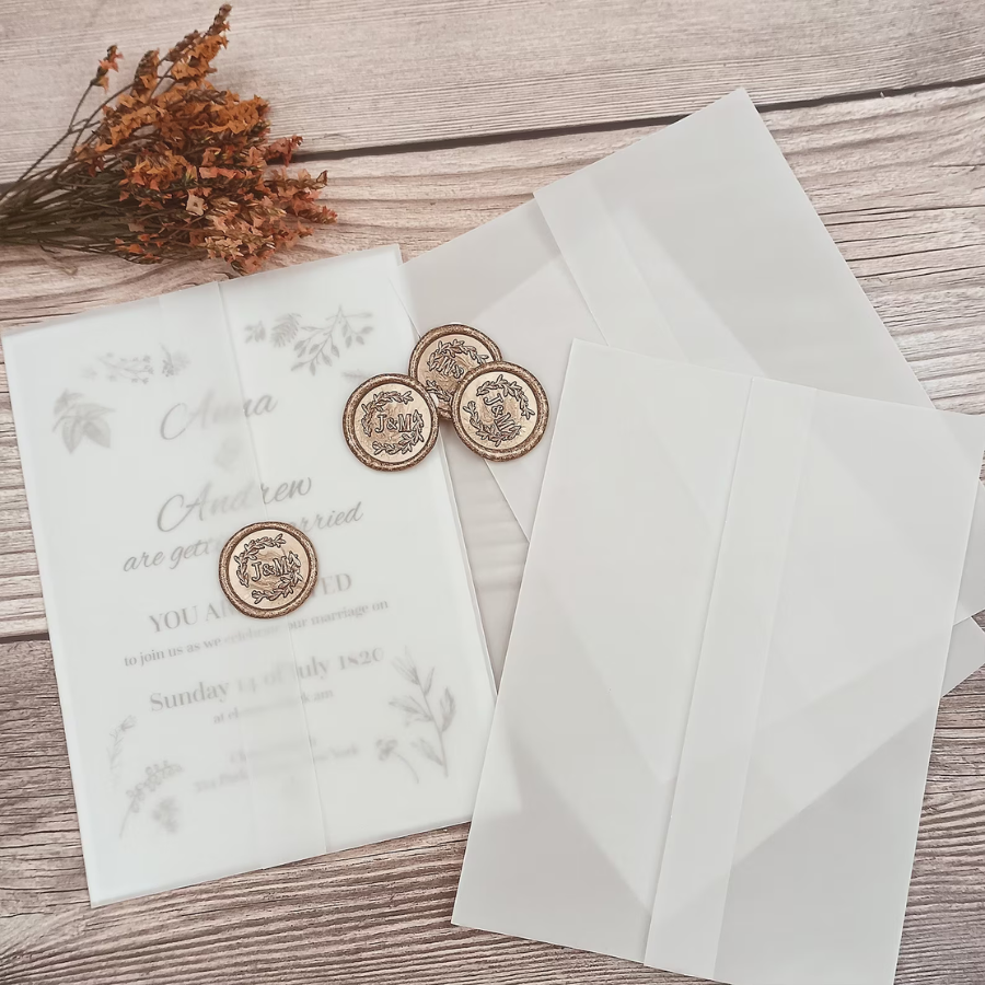 Wedding invitations with a vellum jacket and wax seal