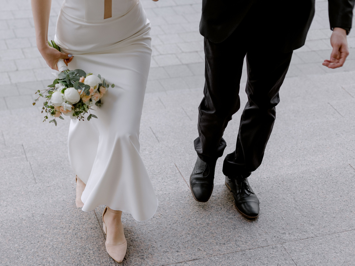 Married couple walking down the aisle after ceremony