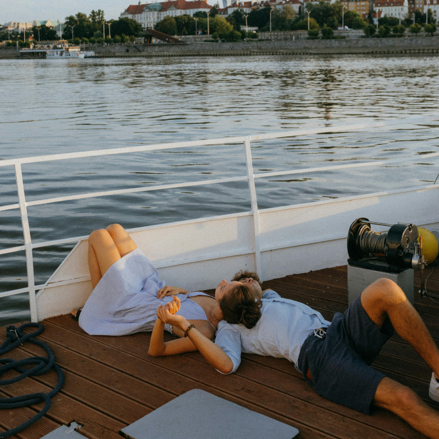 Couple lying on a boat together